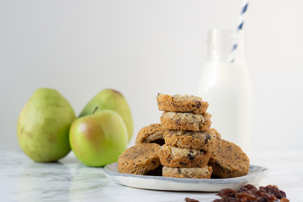 plate of homemade aussie bites with apples and a glass of milk in the background